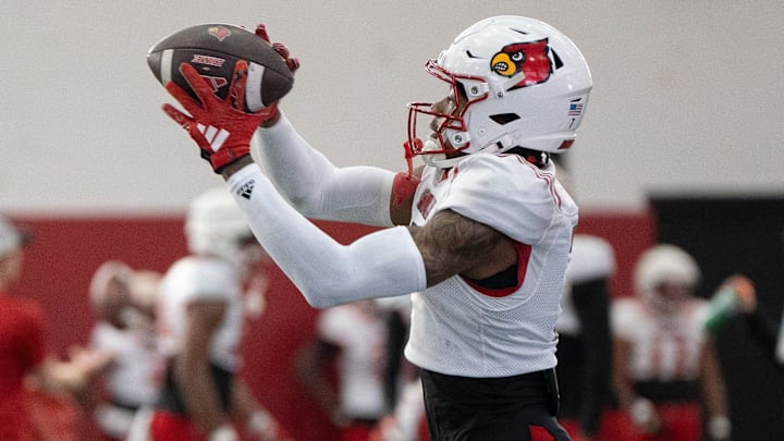 Louisville football wide receiver Jimmy Calloway (7) runs drills during spring practice on Saturday, March 23, 2024 at the Trager practice facility in Louisville, Ky.