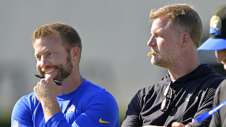 Jul 29, 2024; Los Angeles, CA, USA; Los Angeles Rams head coach Sean McVay, general manager Les Snead and chief of staff Carter Crutchfield talk on the field during training camp at Loyola Marymount University. Mandatory Credit: Jayne Kamin-Oncea-Imagn Images