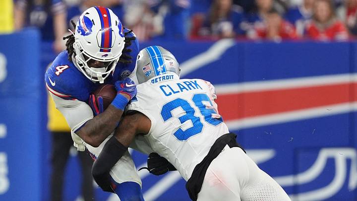 Detroit Lions safety Chuck Clark (36) tackles Buffalo Bills running back James Cook III (4) during the second half Detroit Lions safety Chuck Clark (36) tackles Buffalo Bills running back James Cook III (4) during the second half