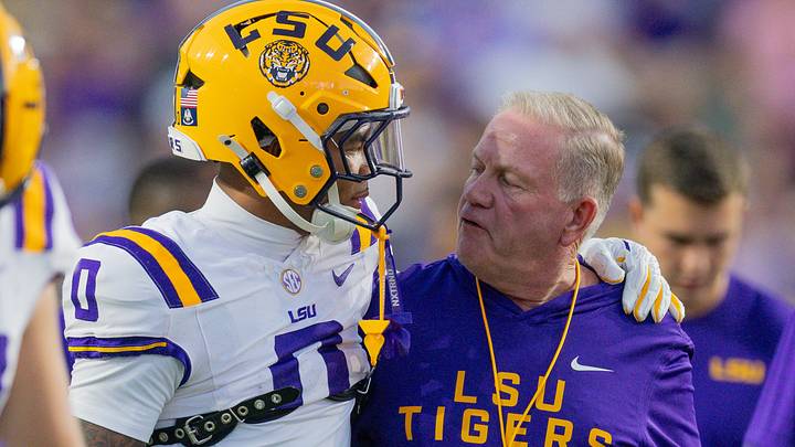 LSU Tigers head coach Brian Kelly talks to wide receiver Zavion Thomas (0) against the South Carolina Gamecocks during the first half at Tiger Stadium. 