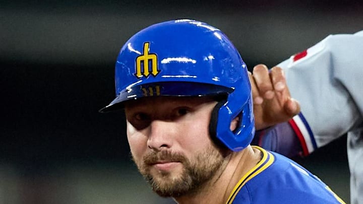 Seattle Mariners catcher Cal Raleigh (29) and Texas Rangers second baseman Marcus Semien (2) look to first on a double play attempt during the sixth inning at T-Mobile Park on Aug 1. 