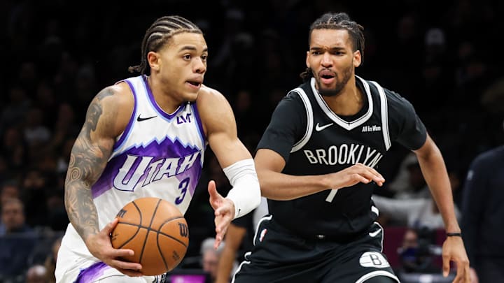 Dec 4, 2025; Brooklyn, New York, USA; Utah Jazz guard Keyonte George (3) dribbles the ball past Brooklyn Nets forward Ziaire Williams (1) during the fourth quarter at Barclays Center. Mandatory Credit: Tom Horak-Imagn Images