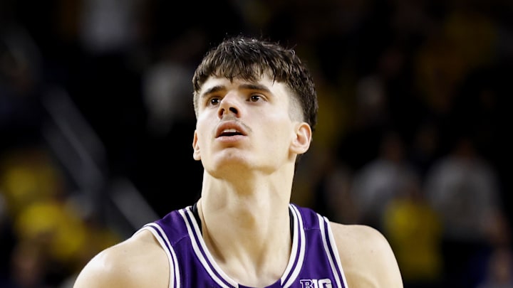 Jan 19, 2025; Ann Arbor, Michigan, USA;  Northwestern Wildcats guard Brooks Barnhizer (13) takes a free throw in overtime against the Michigan Wolverines at Crisler Center. Mandatory Credit: Rick Osentoski-Imagn Images