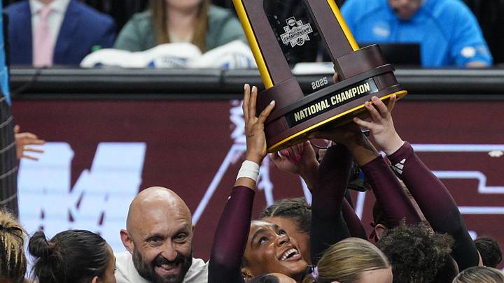 Dec 21, 2025; Kansas City, MO, USA; Texas A&M Aggies middle blocker Ifenna Cos-Okpalla (1) hoists the 2025 NCAA Women’s Volleyball Championship trophy after defeating the Kentucky Wildcats at T-Mobile Center. Mandatory Credit: Jay Biggerstaff-Imagn Images Dec 21, 2025; Kansas City, MO, USA; Texas A&M Aggies middle blocker Ifenna Cos-Okpalla (1) hoists the 2025 NCAA Women’s Volleyball Championship trophy after defeating the Kentucky Wildcats at T-Mobile Center. Mandatory Credit: Jay Biggerstaff-Imagn Images