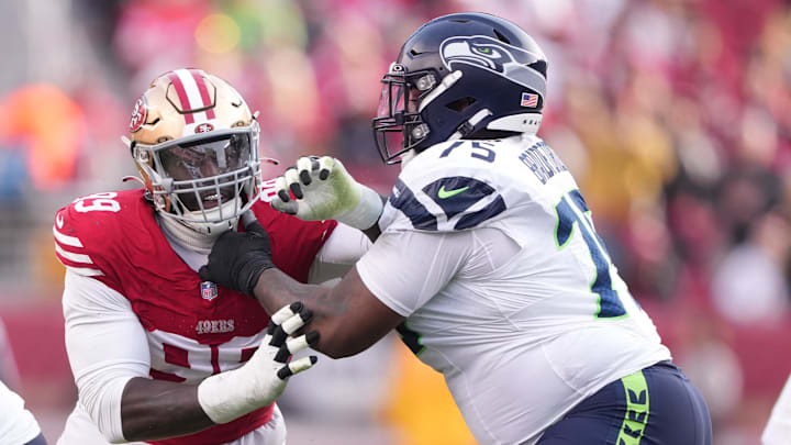 Dec 10, 2023; Santa Clara, California, USA; Seattle Seahawks guard Anthony Bradford (75) blocks San Francisco 49ers defensive tackle Javon Kinlaw (left) during the third quarter at Levi's Stadium.
