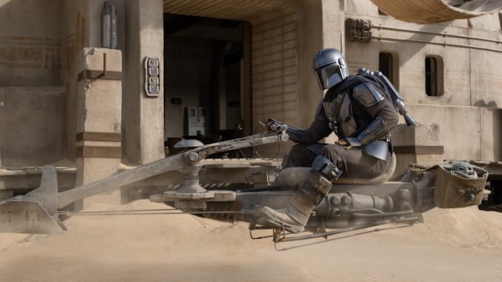 The Mandalorian (Pedro Pascal) and the Child in THE MANDALORIAN, season two, exclusively on Disney+. Image courtesy Disney+