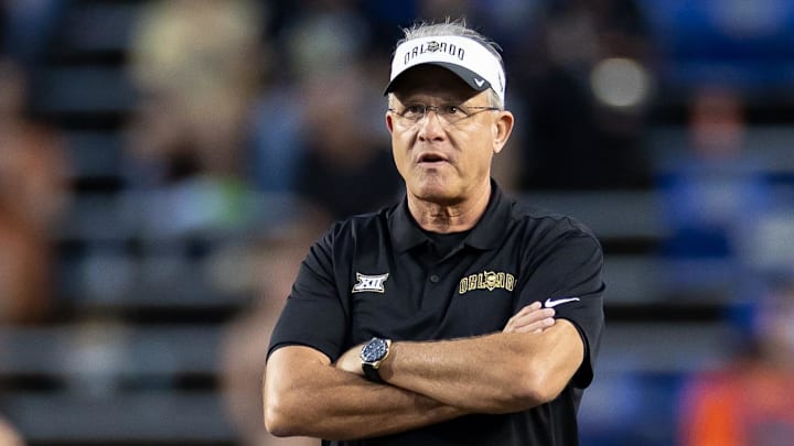 Oct 5, 2024; Gainesville, Florida, USA; UCF Knights head coach Gus Malzahn watches warm ups before a game against the Florida Gators at Ben Hill Griffin Stadium. Mandatory Credit: Matt Pendleton-Imagn Images Oct 5, 2024; Gainesville, Florida, USA; UCF Knights head coach Gus Malzahn watches warm ups before a game against the Florida Gators at Ben Hill Griffin Stadium. Mandatory Credit: Matt Pendleton-Imagn Images