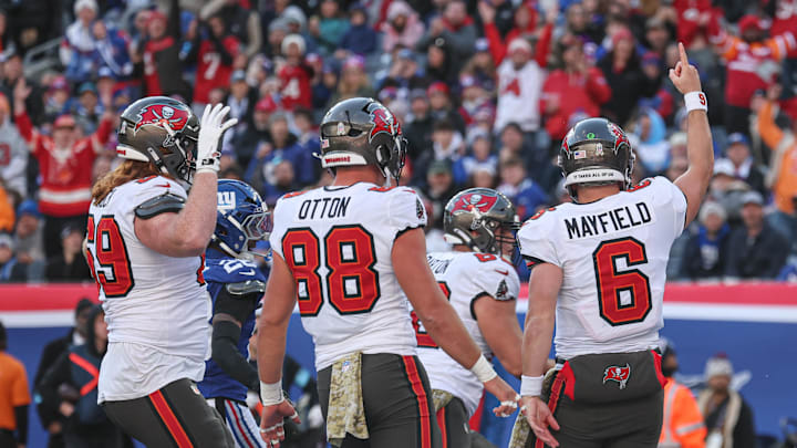 Nov 24, 2024; East Rutherford, New Jersey, USA; Tampa Bay Buccaneers quarterback Baker Mayfield (6) celebrates with teammates after his rushing touchdown during the first half against the New York Giants at MetLife Stadium. Mandatory Credit: Vincent Carchietta-Imagn Images