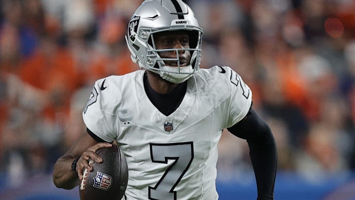 Nov 6, 2025; Denver, Colorado, USA; Las Vegas Raiders quarterback Geno Smith (7) drops back to pass against the Denver Broncos during the first half at Empower Field at Mile High. Mandatory Credit: Isaiah J. Downing-Imagn Images