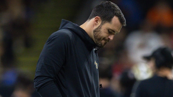 Oct 13, 2024; New Orleans, Louisiana, USA; New Orleans Saints quarterback Derek Carr (4) reacts to a play on the sidelines against the Tampa Bay Buccaneers during the second half at Caesars Superdome. Mandatory Credit: Stephen Lew-Imagn Images Oct 13, 2024; New Orleans, Louisiana, USA; New Orleans Saints quarterback Derek Carr (4) reacts to a play on the sidelines against the Tampa Bay Buccaneers during the second half at Caesars Superdome. Mandatory Credit: Stephen Lew-Imagn Images