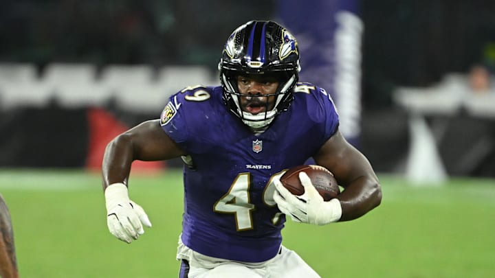 Aug 7, 2025; Baltimore, Maryland, USA; Baltimore Ravens linebacker Jay Higgins IV (49) runs back an interception in front of Indianapolis Colts running back Khalil Herbert (26) during the fourth quarter at M&T Bank Stadium. Mandatory Credit: Rafael Suanes-Imagn Images Aug 7, 2025; Baltimore, Maryland, USA; Baltimore Ravens linebacker Jay Higgins IV (49) runs back an interception in front of Indianapolis Colts running back Khalil Herbert (26) during the fourth quarter at M&T Bank Stadium. Mandatory Credit: Rafael Suanes-Imagn Images