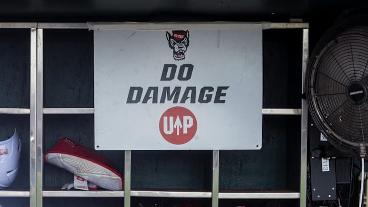 Jun 17, 2024; Omaha, NE, USA; NC State Wolfpack shortstop Brandon Butterworth (3) walks through the dugout before the game against the Florida Gators at Charles Schwab Field Omaha. Mandatory Credit: Dylan Widger-Imagn Images