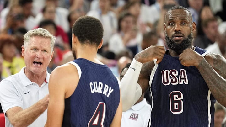 Aug 6, 2024; Paris, France; United States head coach Steve Kerr talks to centre Joel Embiid (11) and small forward Jayson Tatum (10) and shooting guard Stephen Curry (4) and guard LeBron James (6) in the first half against Brazil in a men’s basketball quarterfinal game during the Paris 2024 Olympic Summer Games at Accor Arena. Mandatory Credit: Kyle Terada-Imagn Images Aug 6, 2024; Paris, France; United States head coach Steve Kerr talks to centre Joel Embiid (11) and small forward Jayson Tatum (10) and shooting guard Stephen Curry (4) and guard LeBron James (6) in the first half against Brazil in a men’s basketball quarterfinal game during the Paris 2024 Olympic Summer Games at Accor Arena. Mandatory Credit: Kyle Terada-Imagn Images
