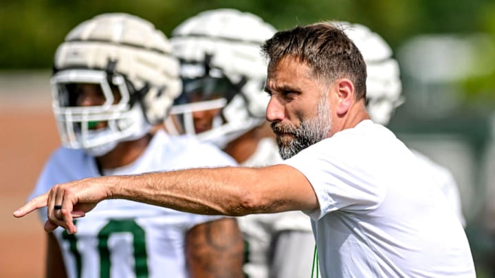 Michigan State's defensive coordinator Joe Rossi works with the defense during the first day of football camp on Tuesday, July 30, 2024, in East Lansing.
