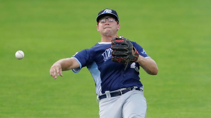 West Michigan Whitecaps' Max Anderson (22) throws to first base against the Wisconsin Timber Rattlers Tuesday, July 9, 2024, at Neuroscience Group Field at Fox Cities Stadium in Grand Chute, Wisconsin. The Timber Rattlers won 4-0.