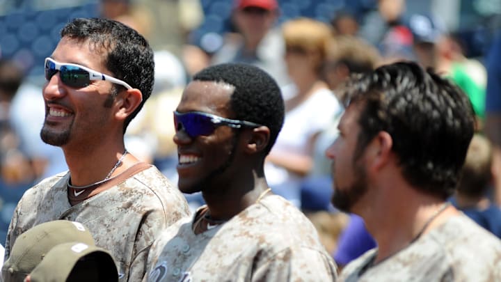 Padres relief pitcher Mike Adams (left) center fielder Cameron Maybin (center) and closer Heath Bell (right) prior to the game against the Colorado Rockies at Petco Park on July 31, 2011.