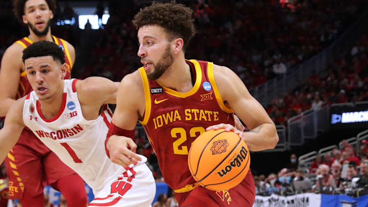 Iowa State guard Gabe Kalscheur (22) drives past Wisconsin guard Johnny Davis (1) during the first half in their second round game of the 2022 NCAA Men's Basketball Tournament Sunday, March 20, 2022 at Fiserv Forum in Milwaukee, Wis.