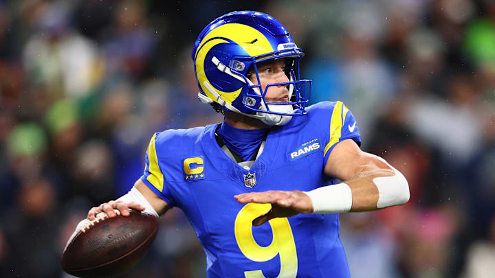 Dec 18, 2025; Seattle, Washington, USA; Los Angeles Rams quarterback Matthew Stafford (9) passes against the Seattle Seahawks in the first half at Lumen Field. Mandatory Credit: Kevin Ng-Imagn Images