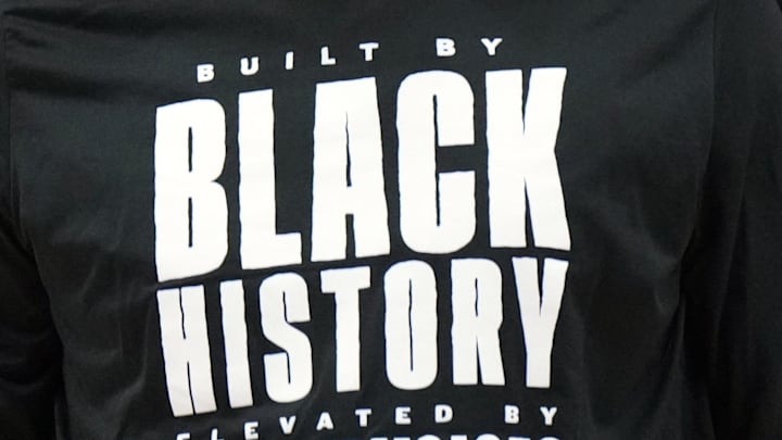 Feb 1, 2025; Portland, Oregon, USA; Portland Trail Blazers center Donovan Clingan (23) wears a Black History Month shirt during warmup before a game against the Phoenix Suns at Moda Center. Mandatory Credit: Soobum Im-Imagn Images