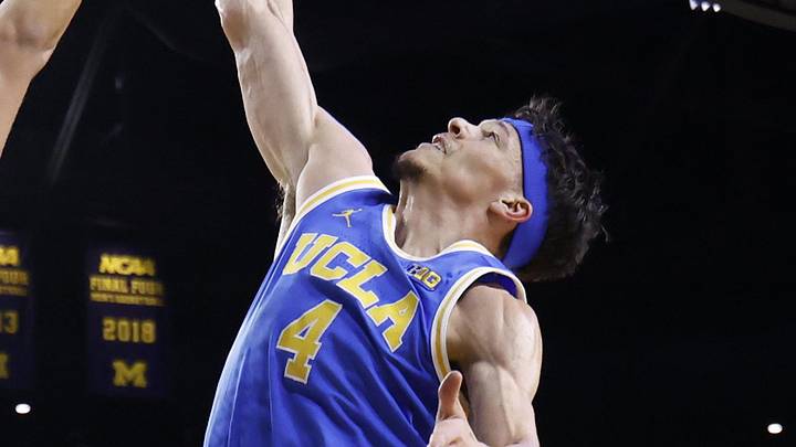 Feb 14, 2026; Ann Arbor, Michigan, USA; Michigan Wolverines center Aday Mara (15) and UCLA Bruins guard Jamar Brown (4) go for the rebound in the first half at Crisler Center. Mandatory Credit: Rick Osentoski-Imagn Images
