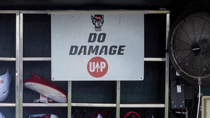 Jun 17, 2024; Omaha, NE, USA; NC State Wolfpack shortstop Brandon Butterworth (3) walks through the dugout before the game against the Florida Gators at Charles Schwab Field Omaha. Mandatory Credit: Dylan Widger-Imagn Images
