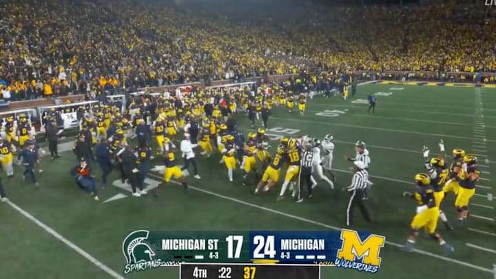Michigan and Michigan State players say goodnight.