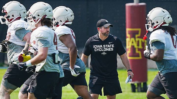 Iowa State football head coach Jimmy Rogers watches the defense warm up during the university’s football open practice at Johnny Majors practice field on August 8, 2026, in Ames, Iowa.