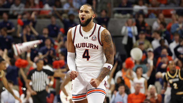 Jan 4, 2025; Auburn, Alabama, USA;  Auburn Tigers forward Johni Broome (4) reacts after making a three-point basket against the Missouri Tigers during the first half at Neville Arena. Mandatory Credit: John Reed-Imagn Images