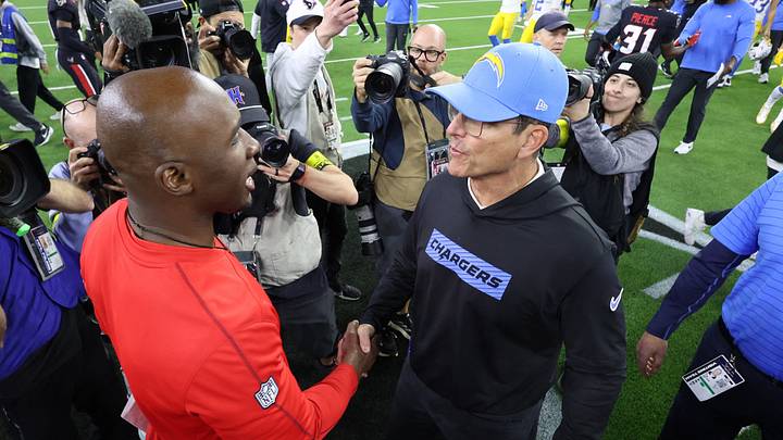 Jan 11, 2025; Houston, Texas, USA; Houston Texans head coach Demeco Ryans (left) and Los Angeles Chargers head coach Jim Harbaugh (right) shake hands after the game in an AFC wild card game at NRG Stadium. Mandatory Credit: Troy Taormina-Imagn Images Jan 11, 2025; Houston, Texas, USA; Houston Texans head coach Demeco Ryans (left) and Los Angeles Chargers head coach Jim Harbaugh (right) shake hands after the game in an AFC wild card game at NRG Stadium. Mandatory Credit: Troy Taormina-Imagn Images