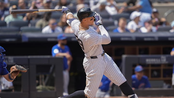 Jul 12, 2025; Bronx, New York, USA; New York Yankees right fielder Aaron Judge (99) hits a double against the Chicago Cubs during the seventh inning at Yankee Stadium. Mandatory Credit: Gregory Fisher-Imagn Images