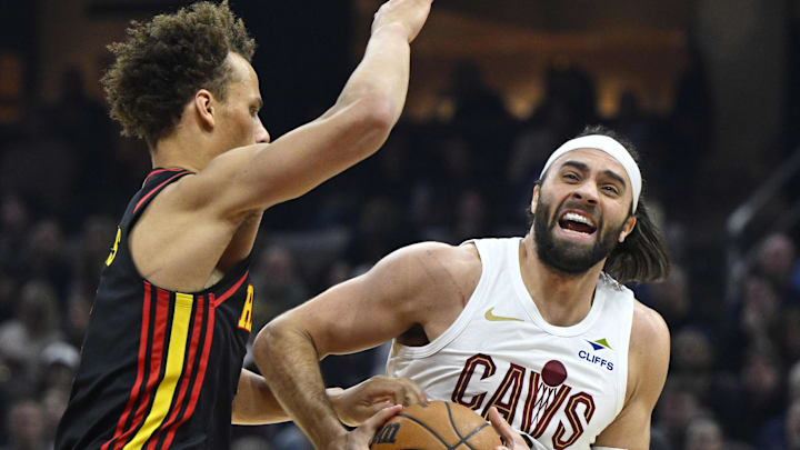 Apr 8, 2026; Cleveland, Ohio, USA; Atlanta Hawks guard Dyson Daniels (5) defends Cleveland Cavaliers guard Max Strus (2) in the third quarter at Rocket Arena. Mandatory Credit: David Richard-Imagn Images