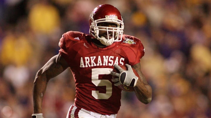 Nov. 23, 2007; Baton Rouge, LA, USA; Arkansas Razorbacks tailback Darren McFadden (5) carries against the LSU Tigers in overtime at Tiger Stadium. The Arkansas Razorbacks defeated the Tigers 50-48 in triple overtime. Mandatory Credit: John David Mercer-Imagn Images Copyright © 2007 John David Mercer