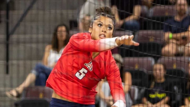Arizona Wildcats women's volleyball outside hitter Jordan Wilson (5) hits the ball against the Arizona State Sun Devils at Mullett Arena in Tempe on Sept. 21, 2023. Arizona Wildcats women's volleyball outside hitter Jordan Wilson (5) hits the ball against the Arizona State Sun Devils at Mullett Arena in Tempe on Sept. 21, 2023.