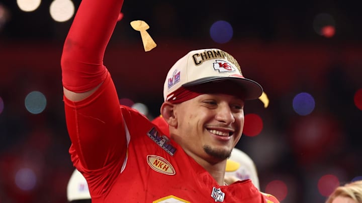 Feb 11, 2024; Paradise, Nevada, USA; Kansas City Chiefs quarterback Patrick Mahomes (15) celebrates with the Vince Lombardi Trophy after defeating the San Francisco 49ers in Super Bowl LVIII at Allegiant Stadium.