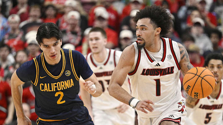 Mar 5, 2025; Louisville, Kentucky, USA;  Louisville Cardinals guard J'Vonne Hadley (1) dribbles against California Golden Bears guard Andrej Stojakovic (2) during the second half at KFC Yum! Center. Louisville defeated California 85-68. Mandatory Credit: Jamie Rhodes-Imagn Images