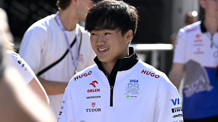 Oct 18, 2024; Austin, Texas, USA; Visa Cash App RB Formula One Team driver Yuki Tsunoda (22) of Team Japan walks through the paddock area before practice for the 2024 US Grand Prix at Circuit of the Americas. Mandatory Credit: Jerome Miron-Imagn Images