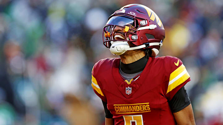 Jayden Daniels celebrates after throwing a touchdown against the Eagles in Week 16.