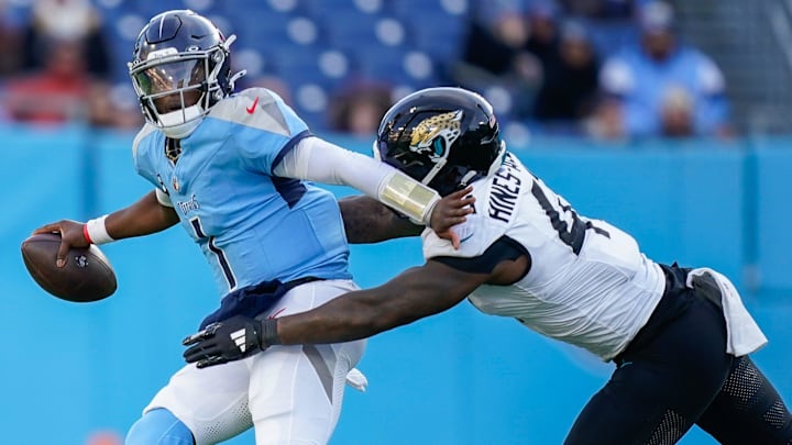 Tennessee Titans quarterback Cam Ward (1) is sacked by Jacksonville Jaguars defensive end Josh Hines-Allen (41) during the fourth quarter at Nissan Stadium in Nashville, Tenn., Sunday, Nov. 30, 2025.