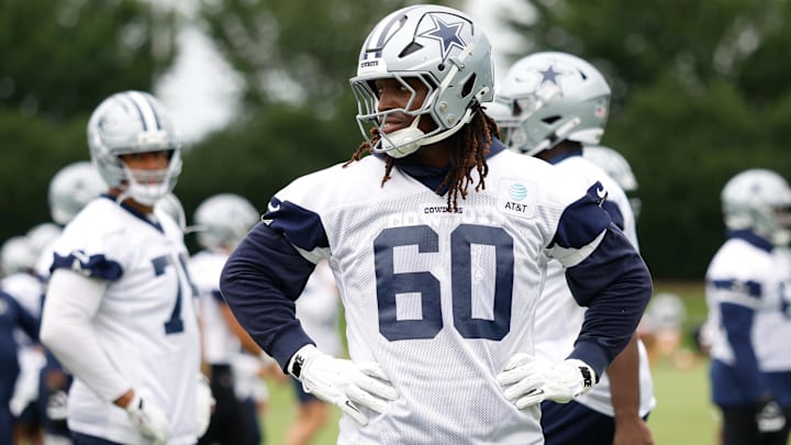 Dallas Cowboys offensive tackle Tyler Guyton (60) goes through a drill during practice at the Ford Center at the Star Training Facility in Frisco, Texas.