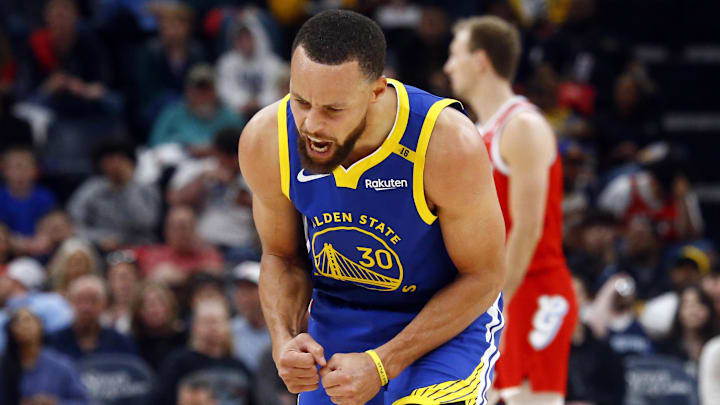 Golden State Warriors guard Stephen Curry reacts to making a shot.