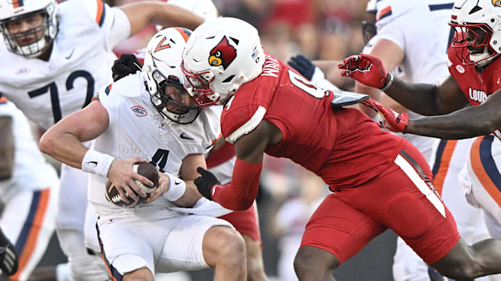 Oct 4, 2025; Louisville, Kentucky, USA; Louisville Cardinals linebacker Antonio Watts (9) sacks Virginia Cavaliers quarterback Chandler Morris (4) during the second half at L&N Federal Credit Union Stadium. Virginia defeated Louisville 30-27. Mandatory Credit: Jamie Rhodes-Imagn Images