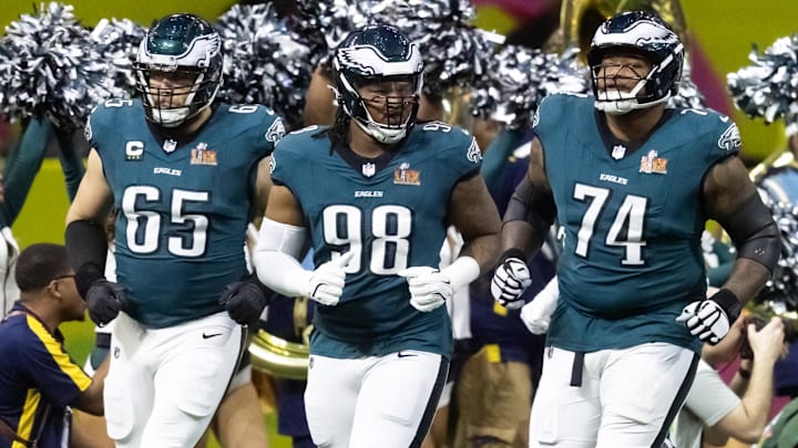 Philadelphia Eagles offensive tackle Lane Johnson (65), defensive end Jalen Carter (98), offensive tackle Fred Johnson (74) and defensive end Brandon Graham (55) enter the field prior to game against the Kansas City Chiefs during Super Bowl LIX at Ceasars Superdome. Mandatory Credit: Mark J. Rebilas-Imagn Images