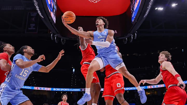 Dec 20, 2025; Atlanta, Georgia, USA; North Carolina Tar Heels guard Seth Trimble (7) shoots against the Ohio State Buckeyes in the second half at State Farm Arena. Mandatory Credit: Brett Davis-Imagn Images
