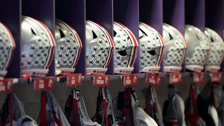 Nov 5, 2022; Evanston, Illinois, USA; Ohio State Buckeyes helmets and uniforms hang in the locker room prior to the NCAA football game between the Northwestern Wildcats and the Ohio State Buckeyes at Ryan Field. Mandatory Credit: Adam Cairns-The Columbus Dispatch Nov 5, 2022; Evanston, Illinois, USA; Ohio State Buckeyes helmets and uniforms hang in the locker room prior to the NCAA football game between the Northwestern Wildcats and the Ohio State Buckeyes at Ryan Field. Mandatory Credit: Adam Cairns-The Columbus Dispatch