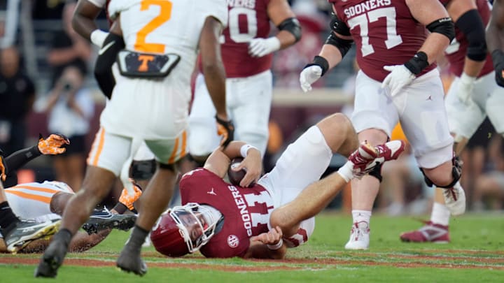 Oklahoma Sooners quarterback Jackson Arnold (11) is brought down during a college football game between the University of Oklahoma Sooners (OU) and the Tennessee Volunteers at Gaylord Family - Oklahoma Memorial Stadium in Norman, Okla., Saturday, Sept. 21, 2024. Oklahoma Sooners quarterback Jackson Arnold (11) is brought down during a college football game between the University of Oklahoma Sooners (OU) and the Tennessee Volunteers at Gaylord Family - Oklahoma Memorial Stadium in Norman, Okla., Saturday, Sept. 21, 2024.