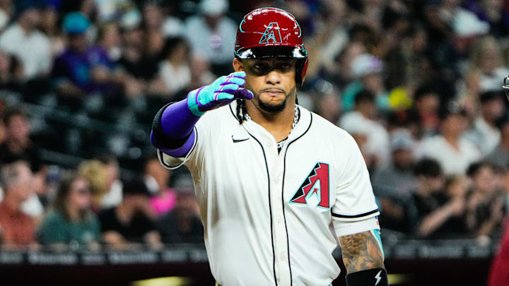 Jul 3, 2025; Phoenix, Arizona, USA; Arizona Diamondbacks second base Ketel Marte (4) salutes during the first inning during a game between the Arizona Diamondbacks and the San Francisco Giants at Chase Field. Mandatory Credit: Arianna Grainey-Imagn Images