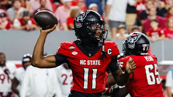 Sep 27, 2025; Raleigh, North Carolina, USA; North Carolina State Wolfpack quarterback CJ Bailey (11) with the ball during the first half of the game against Virginia Tech Hokies at Carter-Finley Stadium. Mandatory Credit: Jaylynn Nash-Imagn Images
