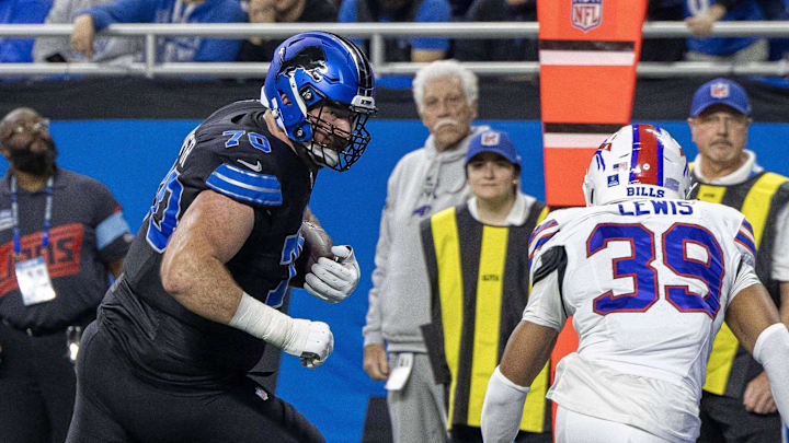 Detroit Lions offensive tackle Dan Skipper (70) runs for a touchdown against the Buffalo Bills during the second quarter at Ford Field Detroit Lions offensive tackle Dan Skipper (70) runs for a touchdown against the Buffalo Bills during the second quarter at Ford Field
