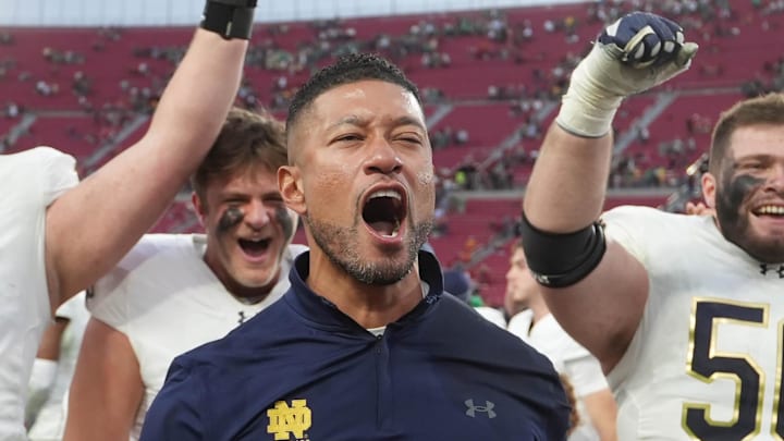 Nov 30, 2024; Los Angeles, California, USA; Notre Dame Fighting Irish head coach Marcus Freeman celebrates with players at the end of the game against the Southern California Trojans at United Airlines Field at Los Angeles Memorial Coliseum. Nov 30, 2024; Los Angeles, California, USA; Notre Dame Fighting Irish head coach Marcus Freeman celebrates with players at the end of the game against the Southern California Trojans at United Airlines Field at Los Angeles Memorial Coliseum.