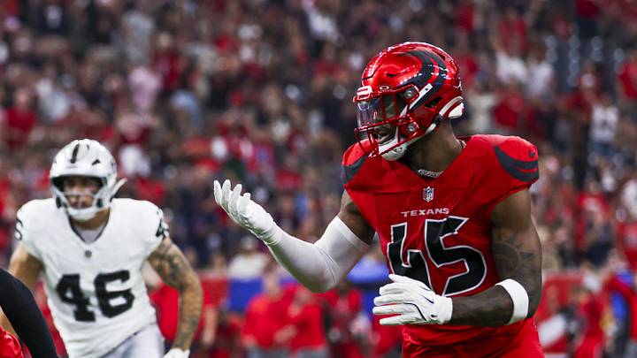 Dec 21, 2025; Houston, Texas, USA; Houston Texans cornerback Derek Stingley Jr. (24) returns an interception for a touchdown against the Las Vegas Raiders during the first quarter at NRG Stadium. Houston Texans linebacker E.J. Speed (45) follows Stingley Jr. at left. Mandatory Credit: Thomas Shea-Imagn Images